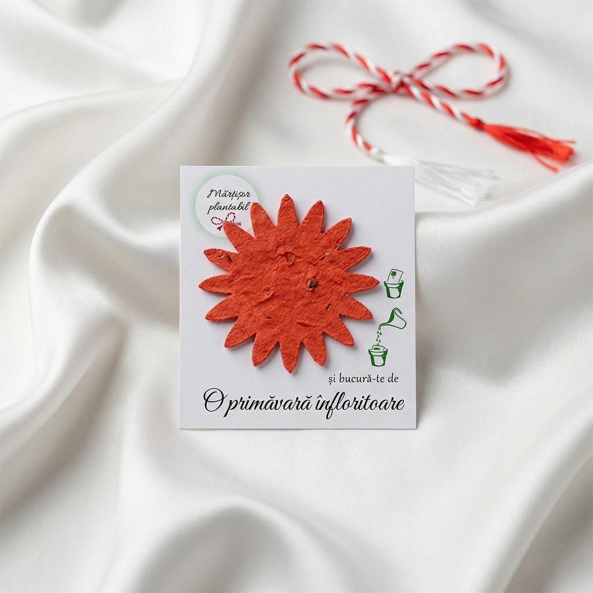 Mărțișor cu figurină floare portocalie plantabilă.